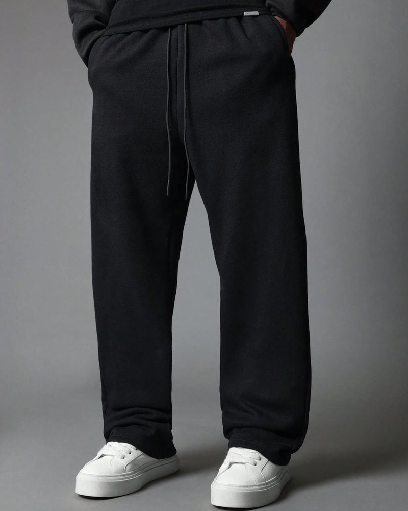 FLYNOFF Black Solid Drawstring Loose Fit Track Pant - Image 1